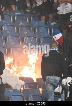 Ostsee Stadium in Rostock, Germany, 14 August 2017. Rostock, Germany. 14th Aug, 2017. Spectators setting stadium seats on fire during the DFB Cup match pitting Hansa Rostock vs Hertha BSC at the Ostsee Stadium in Rostock, Germany, 14 August 2017. The game was interrupted at minute 76 due to riots amongst spectators. Credit: dpa picture alliance/Alamy Live News Stock Photo