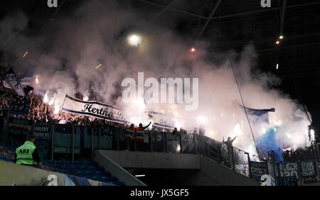 Ostsee Stadium in Rostock, Germany, 14 August 2017. Berlin supporters lighting fireworks during the DFB Cup match pitting Hansa Rostock vs Hertha BSC at the Ostsee Stadium in Rostock, Germany, 14 August 2017. The game was interrupted at minute 76 due to riots amongst spectators. Credit: dpa picture alliance/Alamy Live News Stock Photo