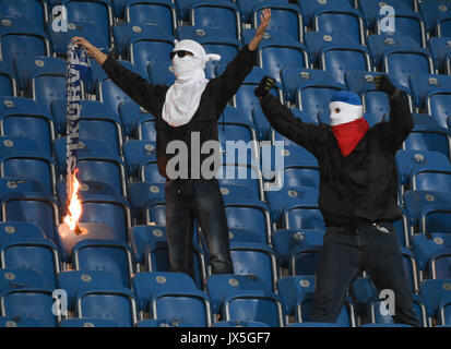 Ostsee Stadium in Rostock, Germany, 14 August 2017. Hooligans burning a Hertha fan's scarf during the DFB Cup match pitting Hansa Rostock vs Hertha BSC at the Ostsee Stadium in Rostock, Germany, 14 August 2017. The game was interrupted at minute 76 due to riots amongst spectators. Credit: dpa picture alliance/Alamy Live News Stock Photo