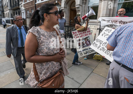 London, UK. 14th Aug, 2017. London, UK. 14th August 2017. People attending the Vedanta AGM walk past the noisy protest by grass roots campaign Foil Vedanta. The protesters accuse Vedanta of illegal mining in Goa, of increasing harassment, torture and false accusations against tribal activists in Nyamgiri, Odisha, who have used Indian laws to stop bauxite mining of their sacred mountain, eleven years of ruinous and continuing pollution by Konkola Copper Mines (KCM) in Zambia, where they say the company have fraudulently avoided taxes and failed to publish mandatory accounts and other offen Stock Photo