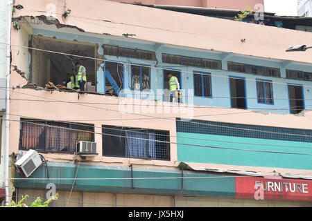 Dhaka, Bangladesh. 15th Aug, 2017. Investigators work on the site of a damaged hotel after a raid on the hideout of a suspected militant in Dhaka, Bangladesh, on Aug. 15, 2017. A suspected militant was killed in a suicide blast during a raid on a hotel in Bangladesh capital Dhaka on Tuesday, the country's police chief told journalists. Credit: Jibon Ahsan/Xinhua/Alamy Live News Stock Photo