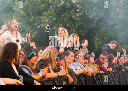 Dumfries, Scotland - August 12, 2017: Members of the audience behind the barrier at a youth music festival. Stock Photo