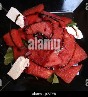 Watermelon Feta Salad, appetizer made with watermelon, feta cheese, arugula, and balsamic vinegar Stock Photo
