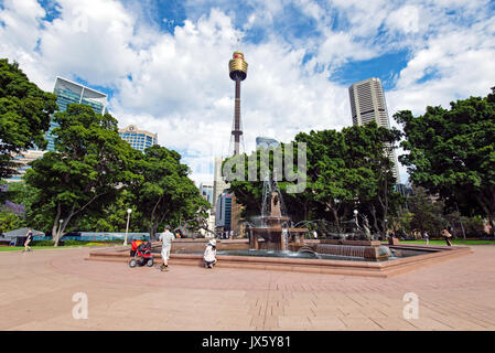 Sydney, Australia - October 21, 2015: Sydney skyline and water fountain in Hyde park. Hyde Park is the oldest public parkland in Australia. Stock Photo