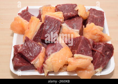 Diced raw meat in pile Stock Photo