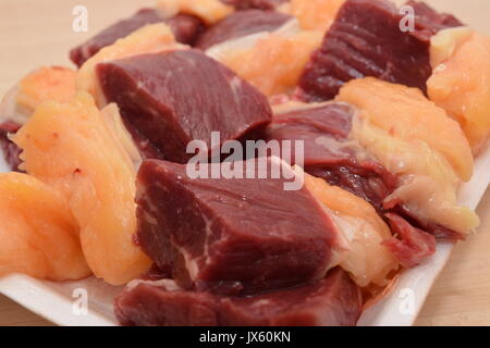 Diced raw meat in pile Stock Photo