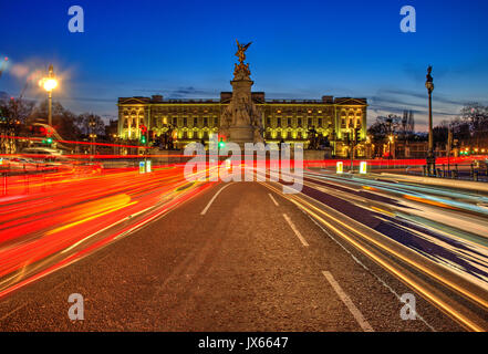 Buckingham palace London at night with traffic trails Stock Photo