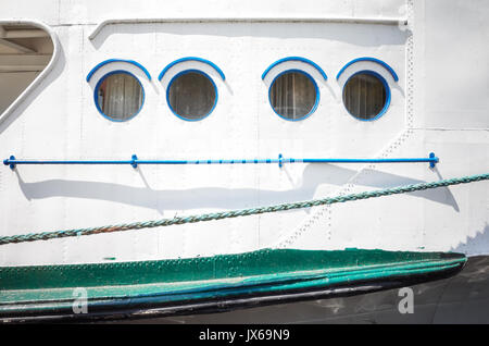 Close up picture of an old ship side and portholes. Stock Photo