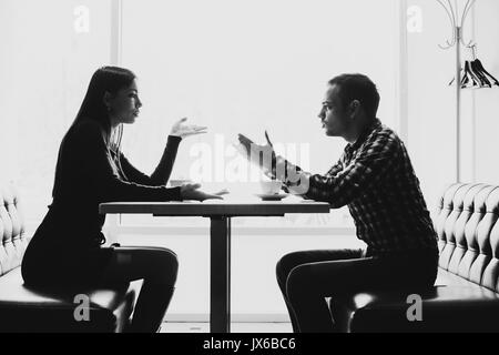 Man and woman in discussions in the restaurant Stock Photo