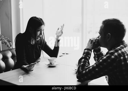 Man and woman in discussions in the restaurant Stock Photo