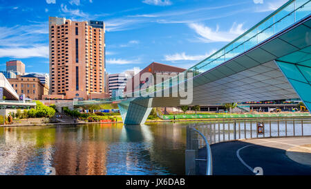 Adelaide, Australia - December 2, 2016: Adelaide city foot bridge leading to InterContinental hotel viewed through Torrens river on a bright day Stock Photo