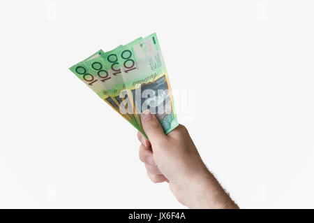 Man holding four hundred Australian Dollar banknotes in his hand Stock Photo