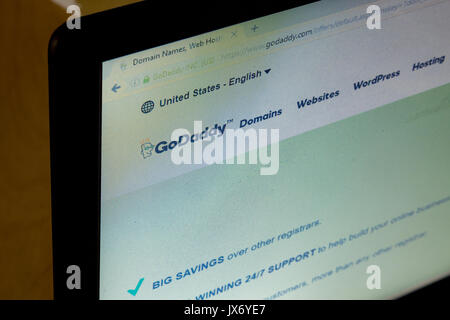 GoDaddy Inc. logo on its website is shown on a laptop computer screen Stock Photo