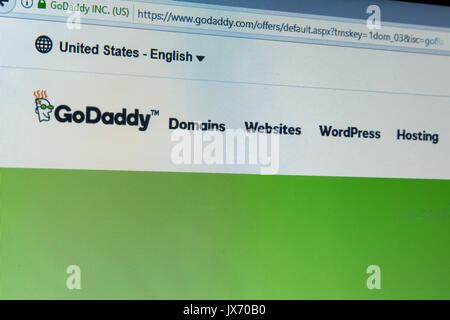 GoDaddy Inc. logo on its website is shown on a laptop computer screen Stock Photo