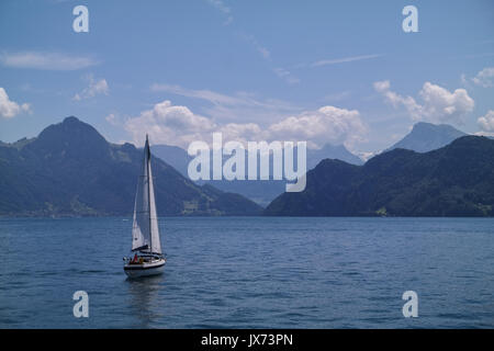 Sailing boat on luzern sea in front of mountains Stock Photo