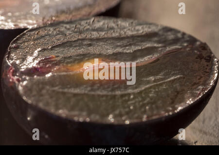 Half cut red grapes on a table. close up Stock Photo