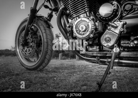 A close up shot of the engine of a custom made motorbike in black and white (chopper) Stock Photo