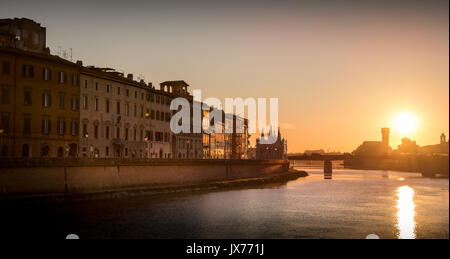 Sunset view of buildings along the river Arno in October 2010, Pisa, Italy Stock Photo