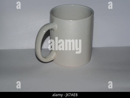 Surabaya,Indonesia -  12 august : this is a white mug that i used for drink, this mug little bit dirty cause i used it everyday Stock Photo