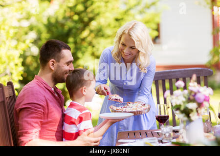 happy family having dinner or summer garden party Stock Photo