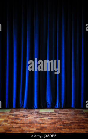 Colorful blue stage curtains and tiled textured floor Stock Photo