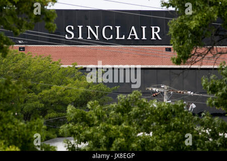 A logo sign outside of the headquarters of the Sinclair Broadcast Group in Cockeysville, Maryland, on August 13, 2017. Stock Photo