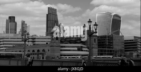 The view from Southwark Bridge showing a train leaving Cannon Street Station, and London's skyscrapers in the background. Stock Photo