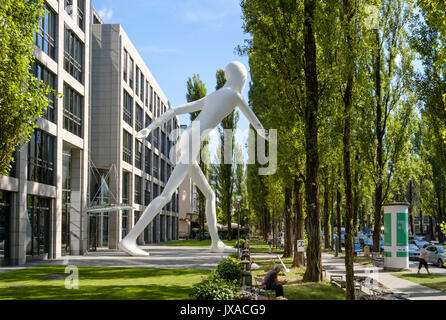 Walking Man sculpture by Jonathan Borofsky in front of insurance company Munich Re, Leopoldstrasse, Schwabing, Munich Stock Photo