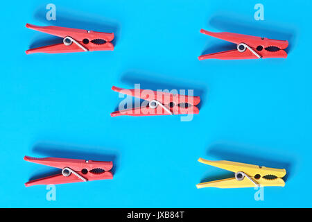 Flat lay concept: colorful clothespins on trendy blue pastel background. Spring or summer is coming concept. View from above. Minimal style with color Stock Photo