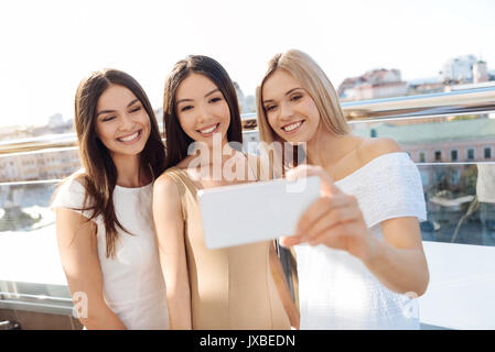 Beautiful women taking selfies Stock Photo - Alamy