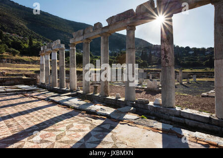 View through the columns of the meat market of Ancient Messini to the village of Mavromati Stock Photo