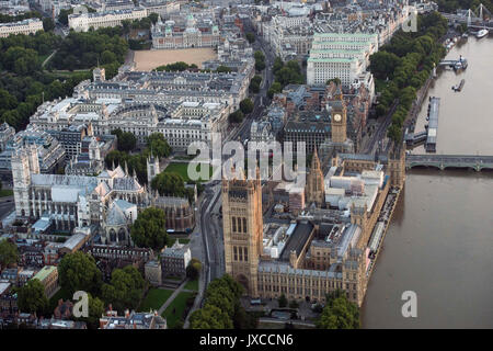 General aerial view of the Houses of Parliament, Portcullis House and Westminster Abbey, Foreign & Commonwealth Office, The Treasury and Horse Guards Parade in Westminster, London. Stock Photo