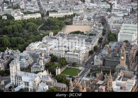 General aerial view of the Houses of Parliament, Portcullis House and Westminster Abbey, Foreign & Commonwealth Office, The Treasury and Horse Guards Parade in Westminster, London. Stock Photo