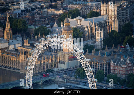 General aerial view of the London Eye, the Houses of Parliament, Portcullis House and Westminster Abbey in Westminster, London. Stock Photo