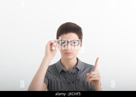 Funny strict teacher with glasses shakes his finger on white background. Stock Photo