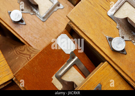 Backgrounds and textures: disorderly group of very old wooden drawers Stock Photo