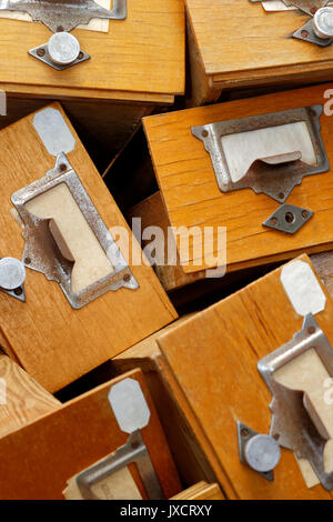 Backgrounds and textures: disorderly group of very old wooden drawers Stock Photo