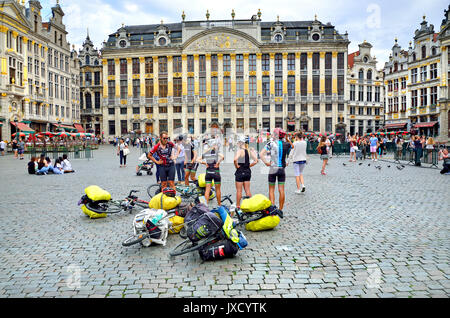 Brussels, Belgium. Grand Place: cyclists having a break Stock Photo