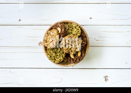 top view granola bar in bowl on wood table background. Stock Photo