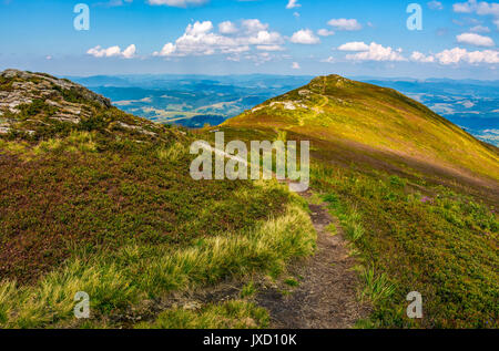 path through the grassy meadows on top of mountain ridge. Classic late summer travel background in Carpathian alps. Wonderful evening weather with blu Stock Photo