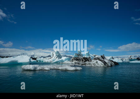 Iceland - At the water surface of glacial lake before giant ice floes Stock Photo