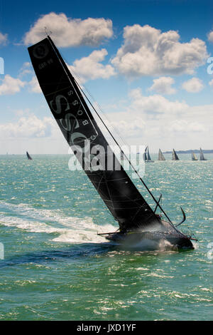 Hugo Boss 60 foot IMOCA racing yacht, GBR99, one of the world's fastest modern racing monohulls, readying for the 2017 Fastnet Race Stock Photo