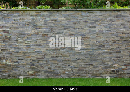 Natural stone cladding in grey, brown golden and silver colour. Stock Photo