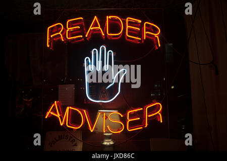 Palm Reader and Adviser Neon Sign in New York - USA Stock Photo