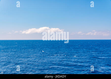 Beautiful blue sea and subtle clouds during cruise Stock Photo