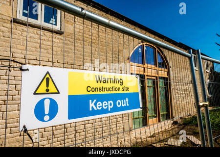 'Warning, construction site, keep out' sign in Langtoft, near Peterborough, Lincolnshire, England, UK. Stock Photo