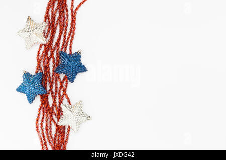 Beautiful white and blue christmas decoration with red ribbons on white background Stock Photo