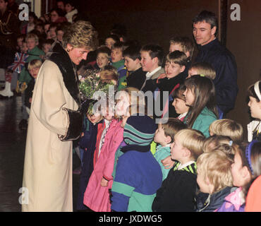 Diana, Princess of Wales, talks with youngsters - some of whose parents are serving in the Gulf - during a visit to the German home of the 7th and 22nd Armoured Brigades, near hanover, Germany. Stock Photo