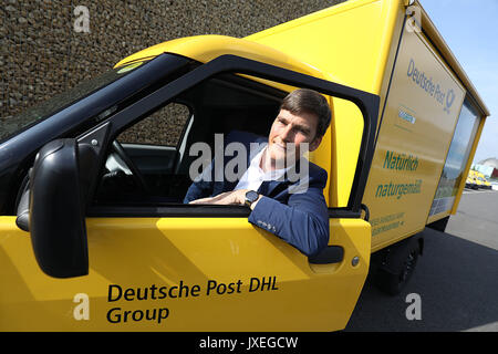 Cologne, Germany. 16th Aug, 2017. Co-founder of StreetScooter GmbH, Achim Kampker, sitting in a StreetScooter in Cologne, Germany, 16 August 2017. Deutsche Post DHL Group and Ford presented the StreetScooter WORK XL electric van. Photo: Oliver Berg/dpa/Alamy Live News Stock Photo