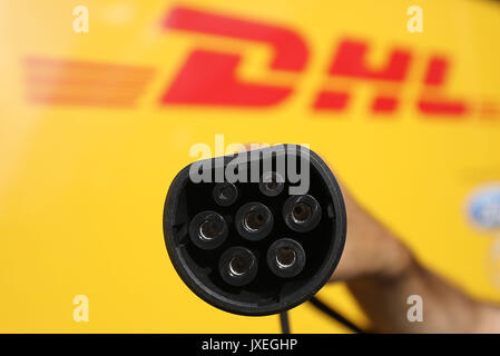 Cologne, Germany. 16th Aug, 2017. A power plug is plugged into an electric vehicle in Cologne, Germany, 16 August 2017. Deutsche Post DHL Group and Ford presented the StreetScooter WORK XL electric van. Photo: Oliver Berg/dpa/Alamy Live News Stock Photo